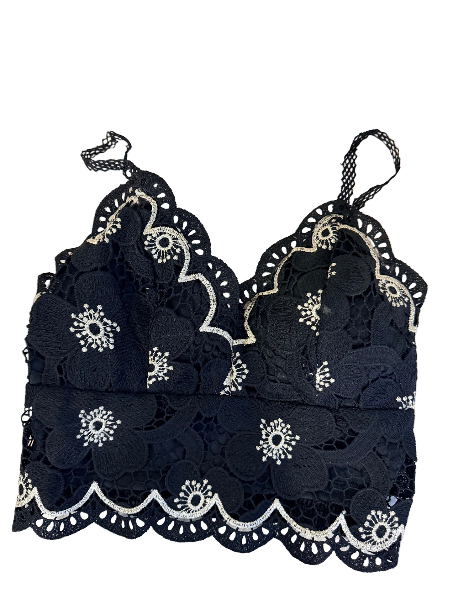 Black lace garment with white floral embroidery