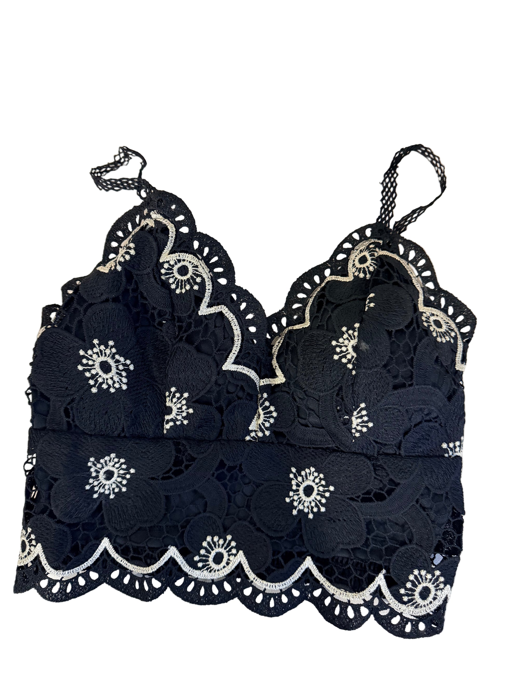 Black lace garment with white floral embroidery 